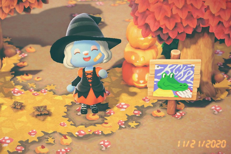 Animal crossing character in which costume waving next t a KCKPL sign in a fall landscape