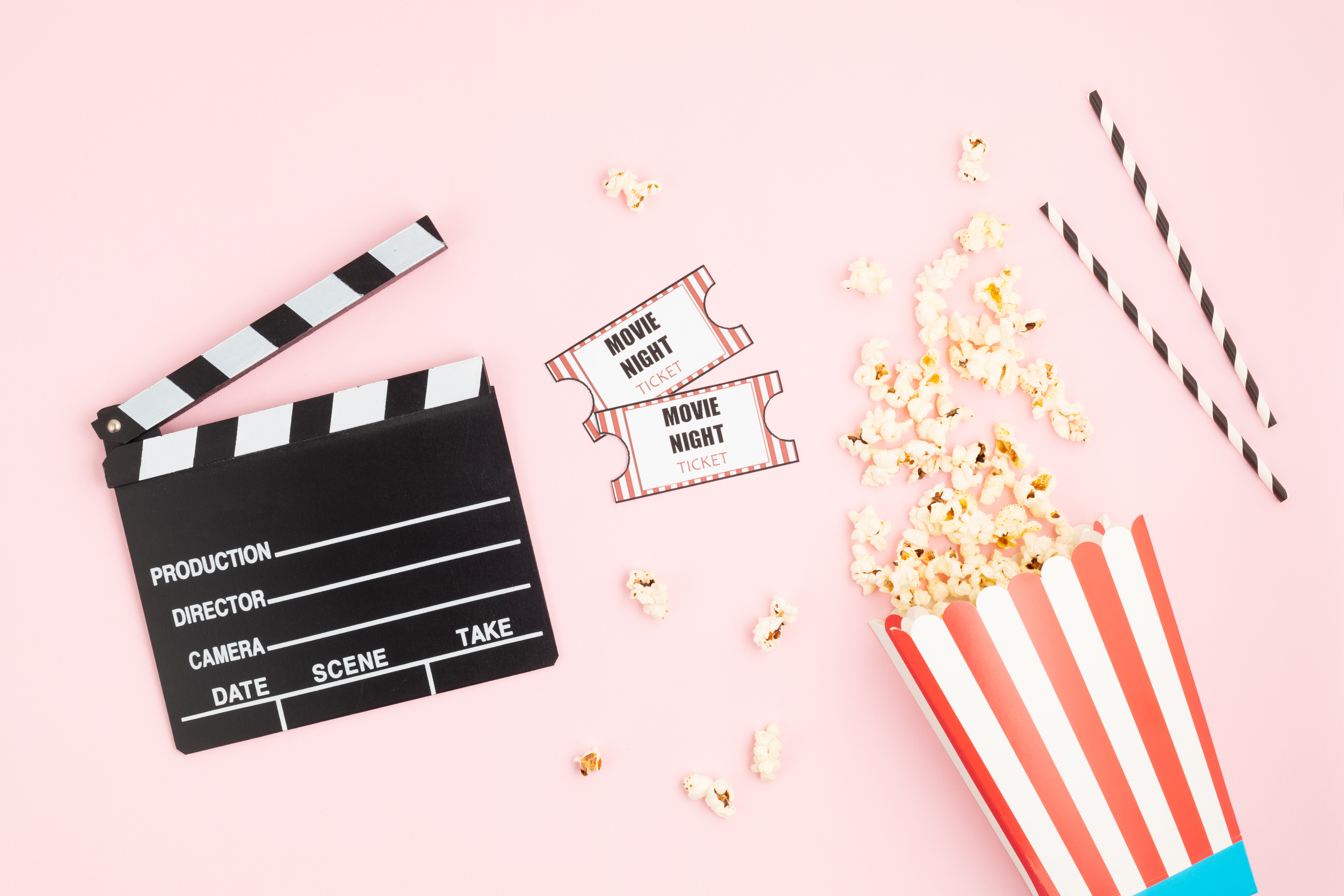 Movie clapboard, popcorn, and tickets