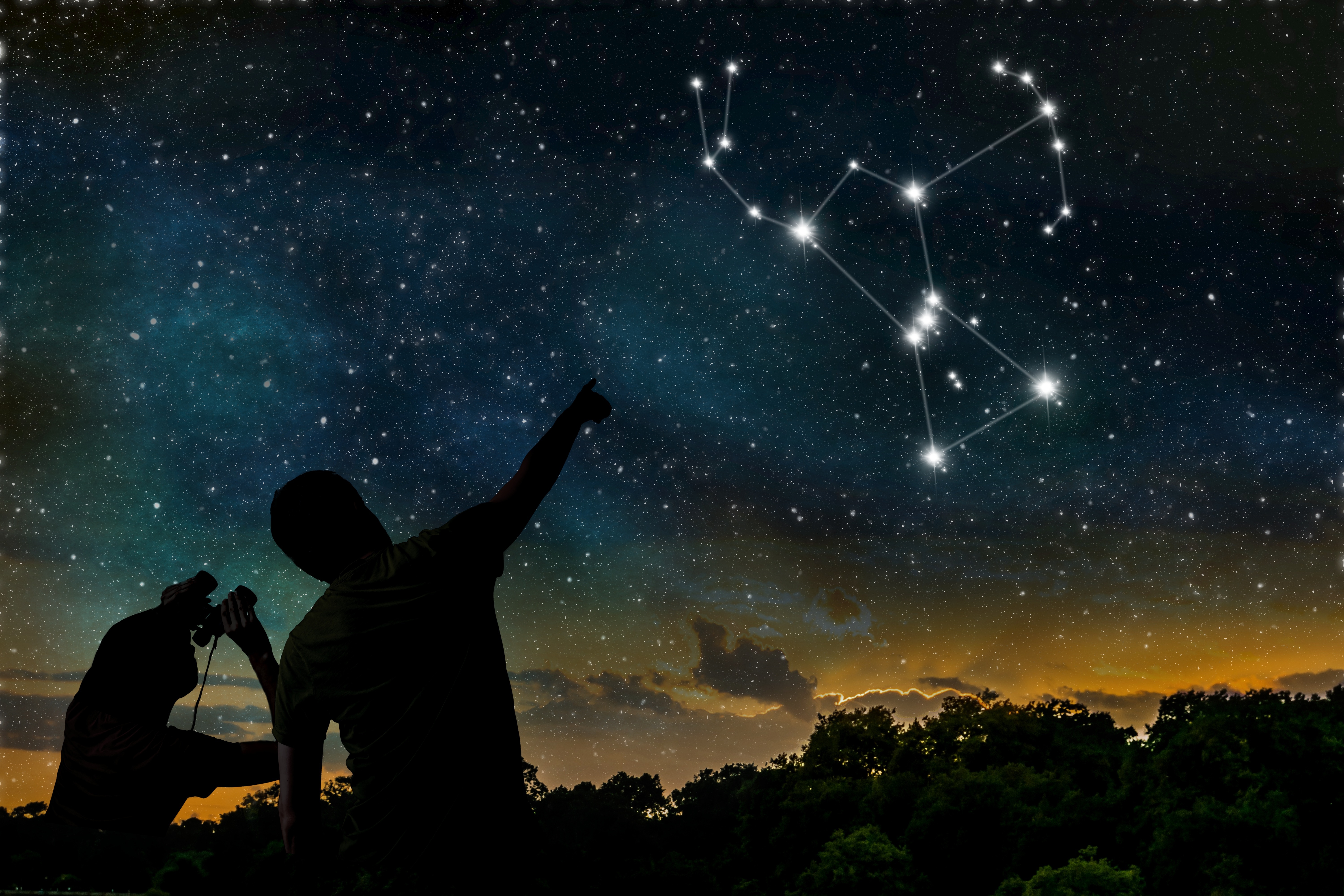 Two individuals observe the constellation Orion in the night sky with binoculars. 