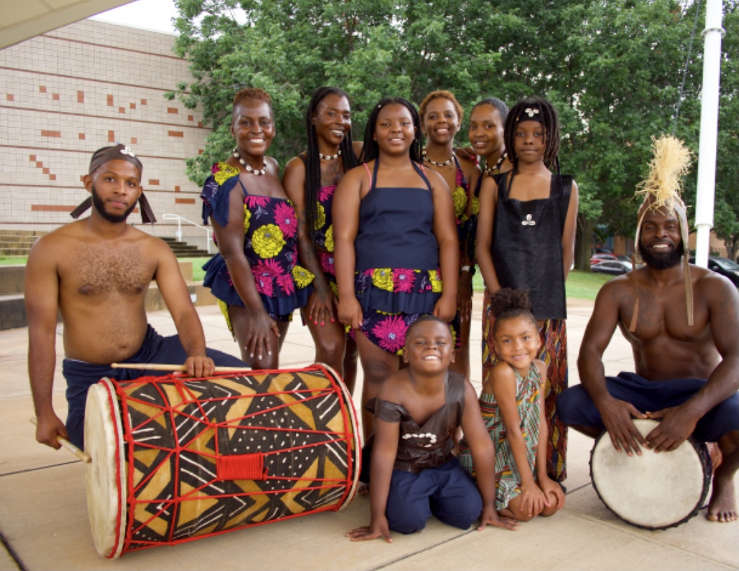 Several Esoke Cultural Arts Center performers pose with West African Drums. 