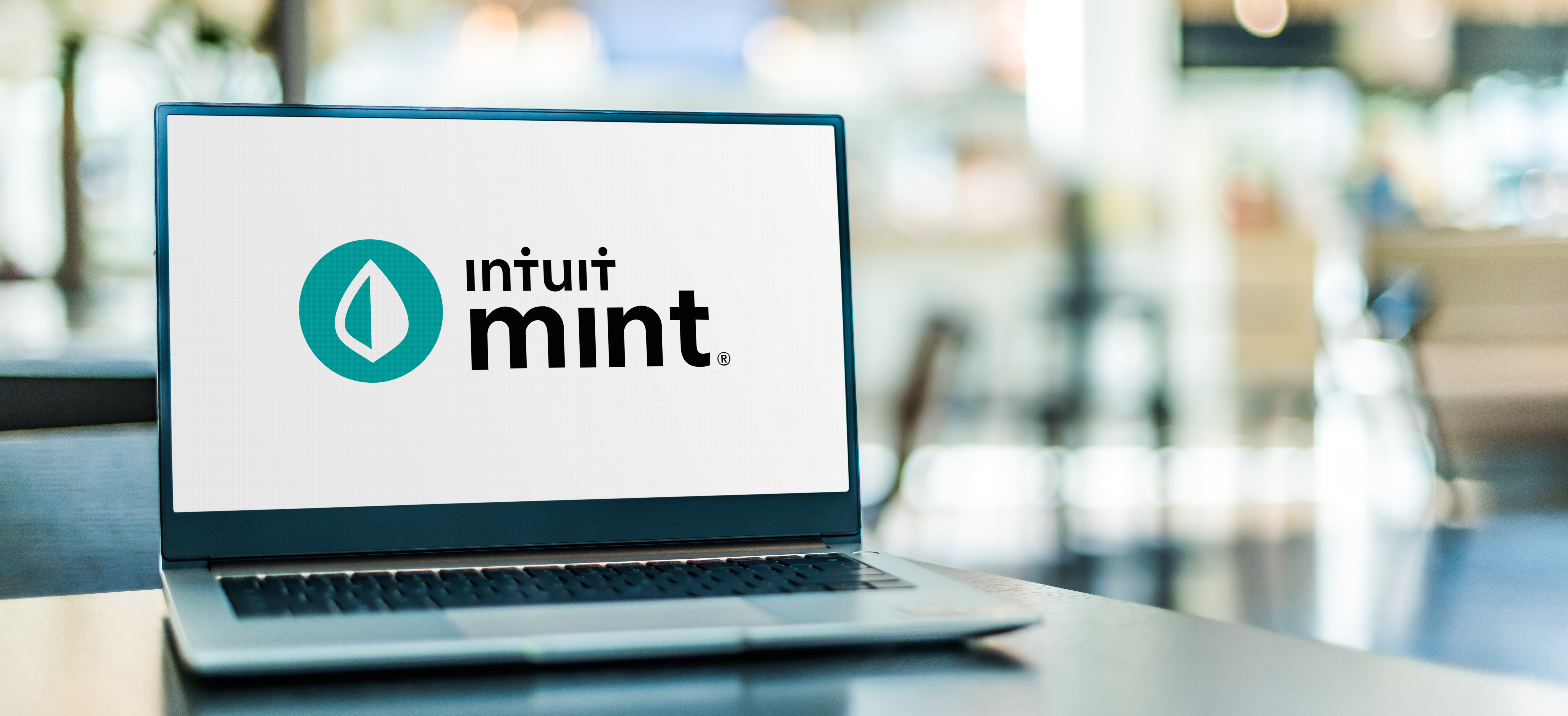 Laptop computer displaying logo of Intuit Mint  