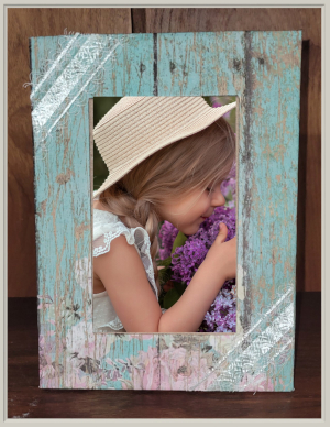 decorative frame with a picture of a young girl and flowers