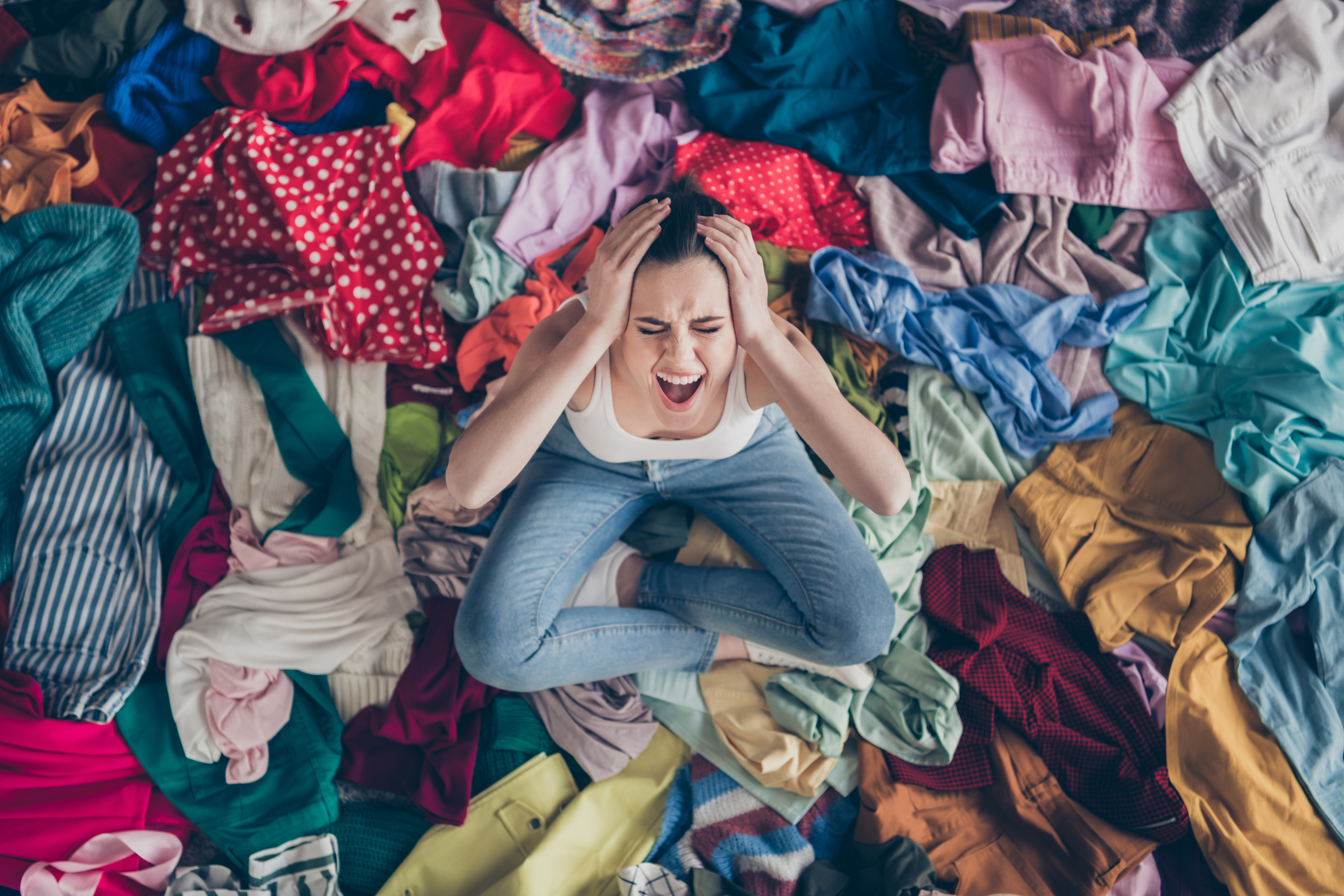 Woman in pile of clothes