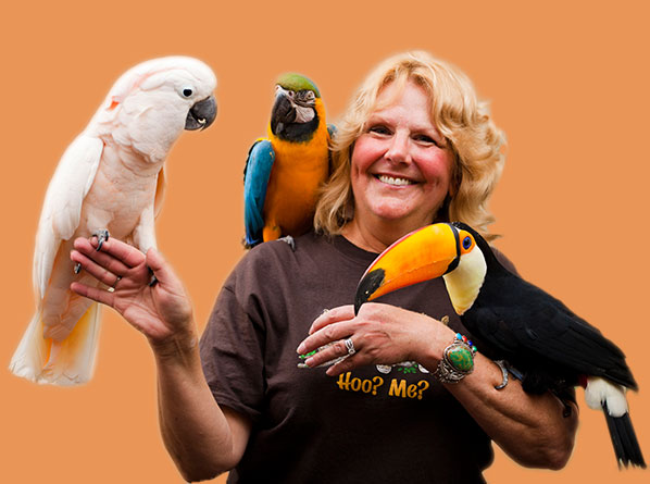 Woman holding tropical birds