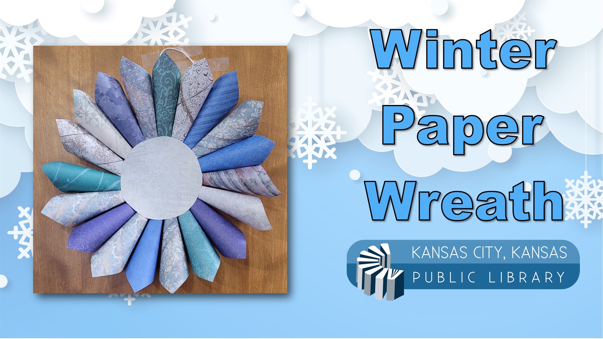 Paper wreath on a blue winter background