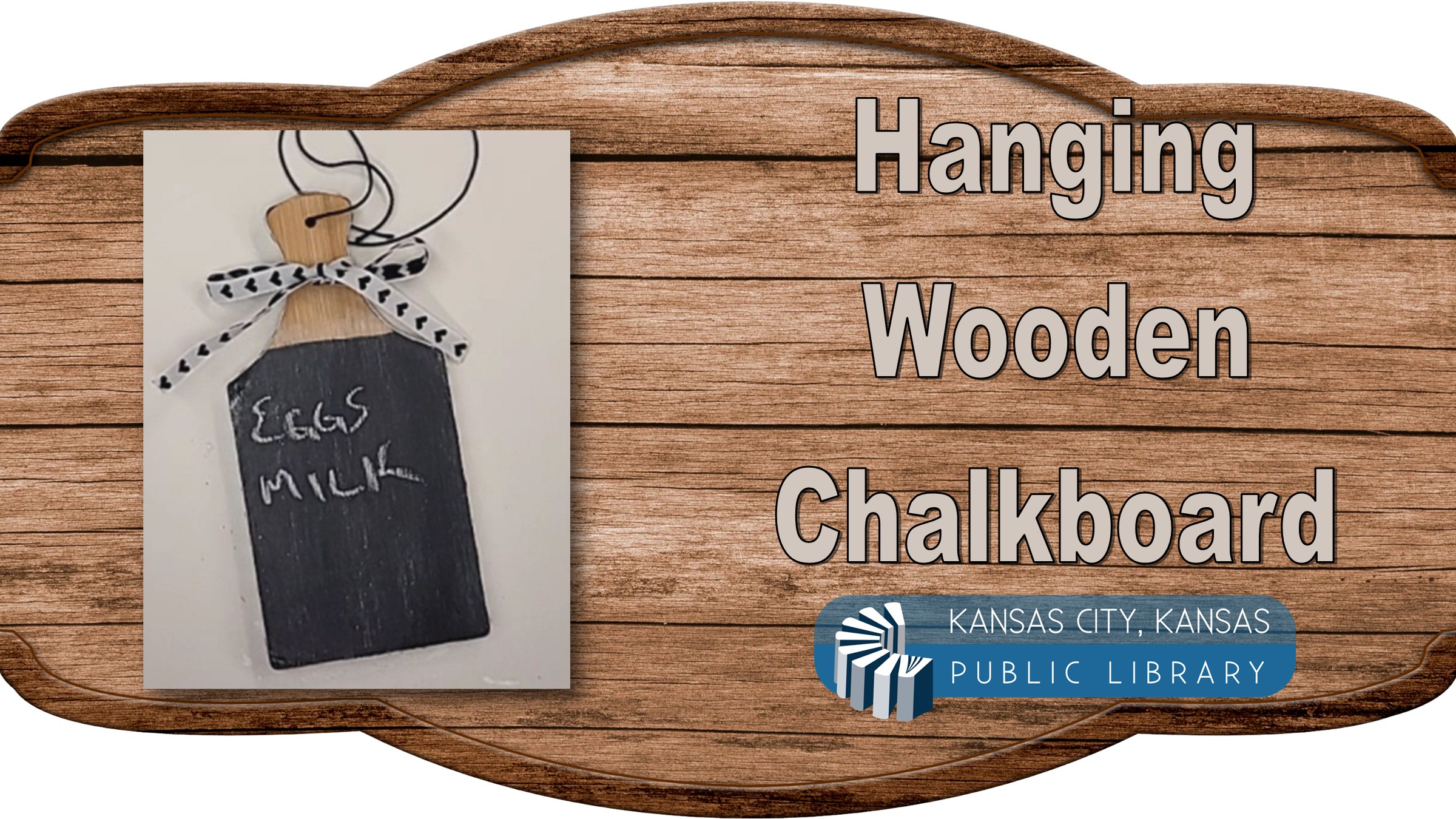 Hanging chalkboard on a wood background