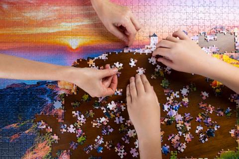 Hands doing a puzzle