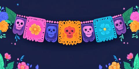 Colorful papel picado with sugar skulls on them against a dark purple background.