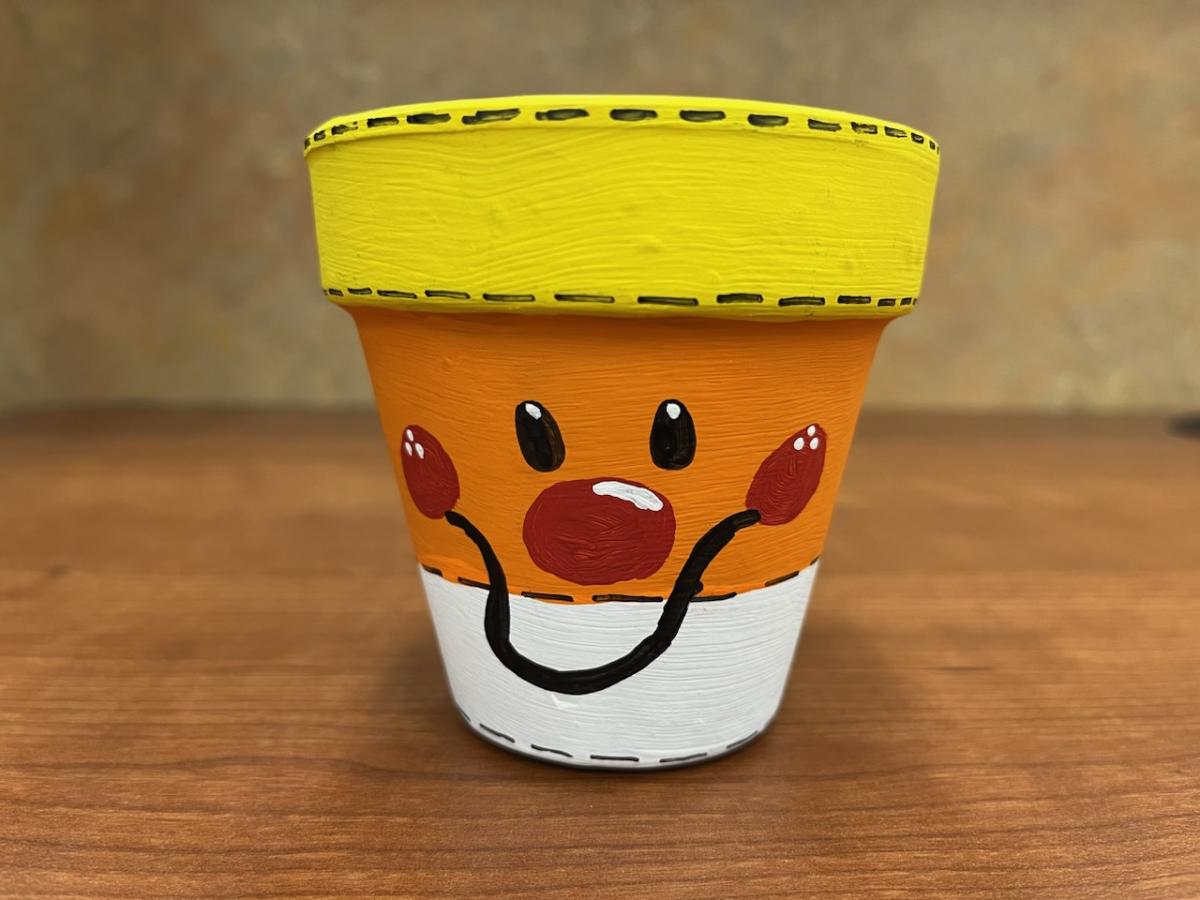 Clay Pot Painted to look like Candy Corn.